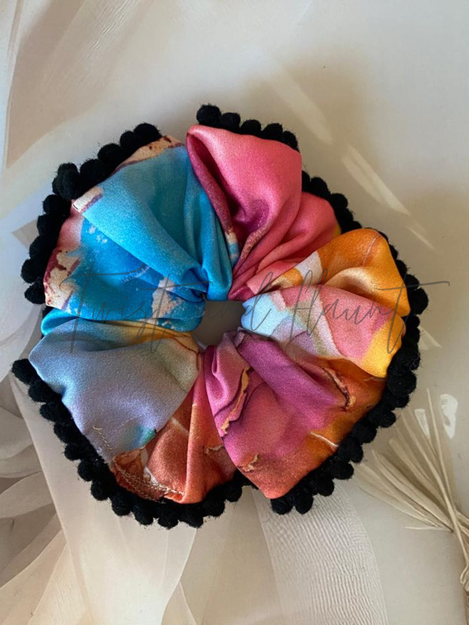 Vibrant Marbled Satin Scrunchie in Blue, Pink, Orange & Yellow with Black Pom Pom Lace